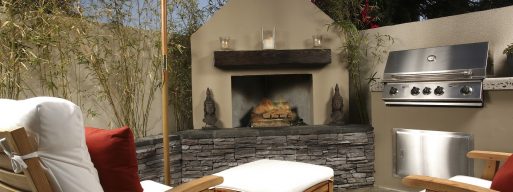 view of a backyard with beautiful patio furniture and a stone firepit