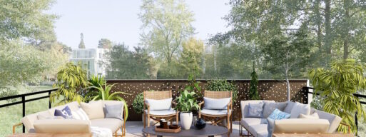 Tan furniture set on a patio with trees in the background
