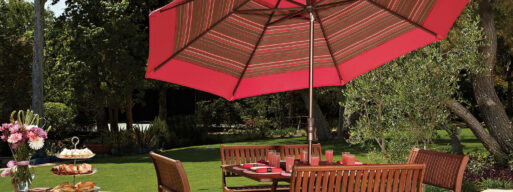 Backyard Dining area on the patio with a nice cantilever umbrellas for shade